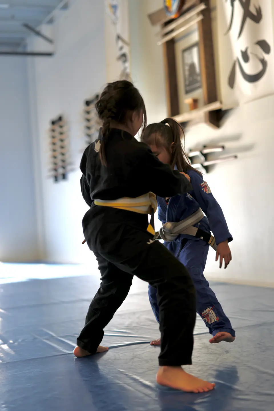 Two young Munchkins teammates practise a standing partner game
